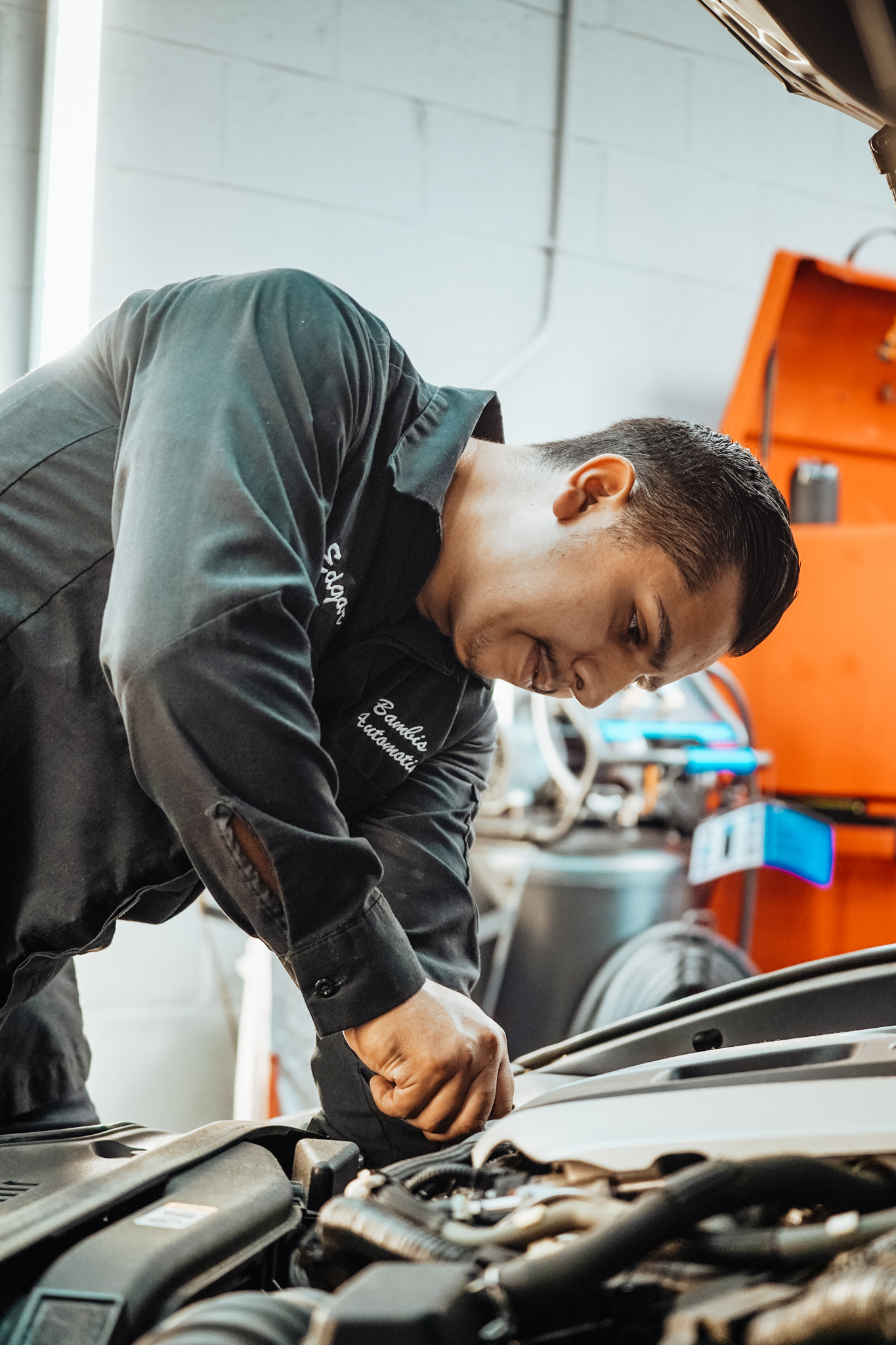 Bambi working on a car engine - Professional automotive service